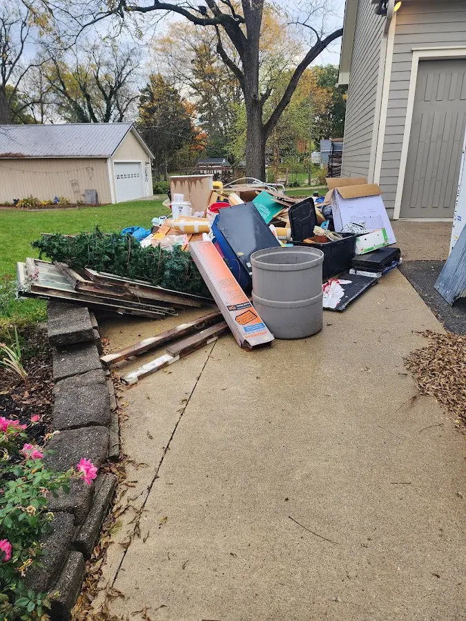 Dumpster being loaded with debris for 30 Yard Dumpster Rental in East Pasadena